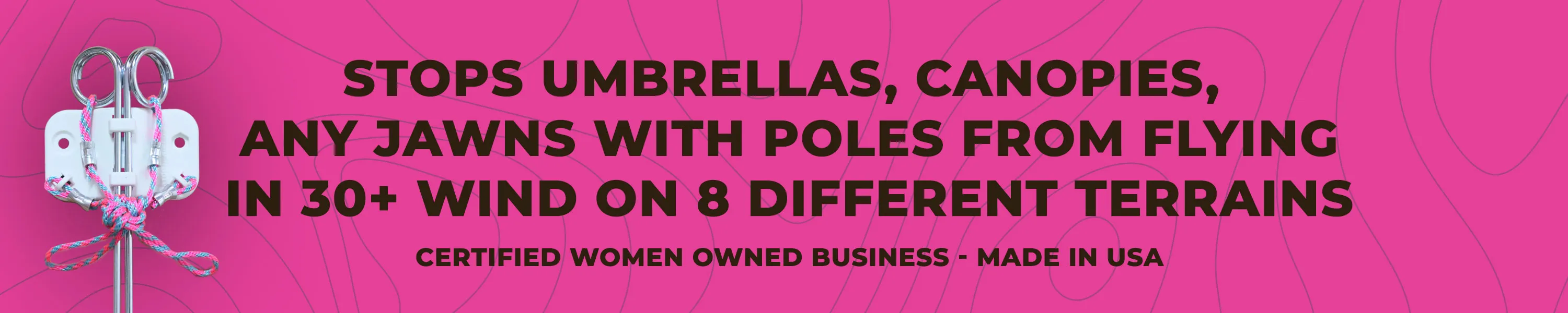 Metal clip device with pink and blue ropes tied, alongside text stating it stops umbrellas, canopies, and poles from flying in 30+ mph wind on various terrains, certified women owned business made in USA.