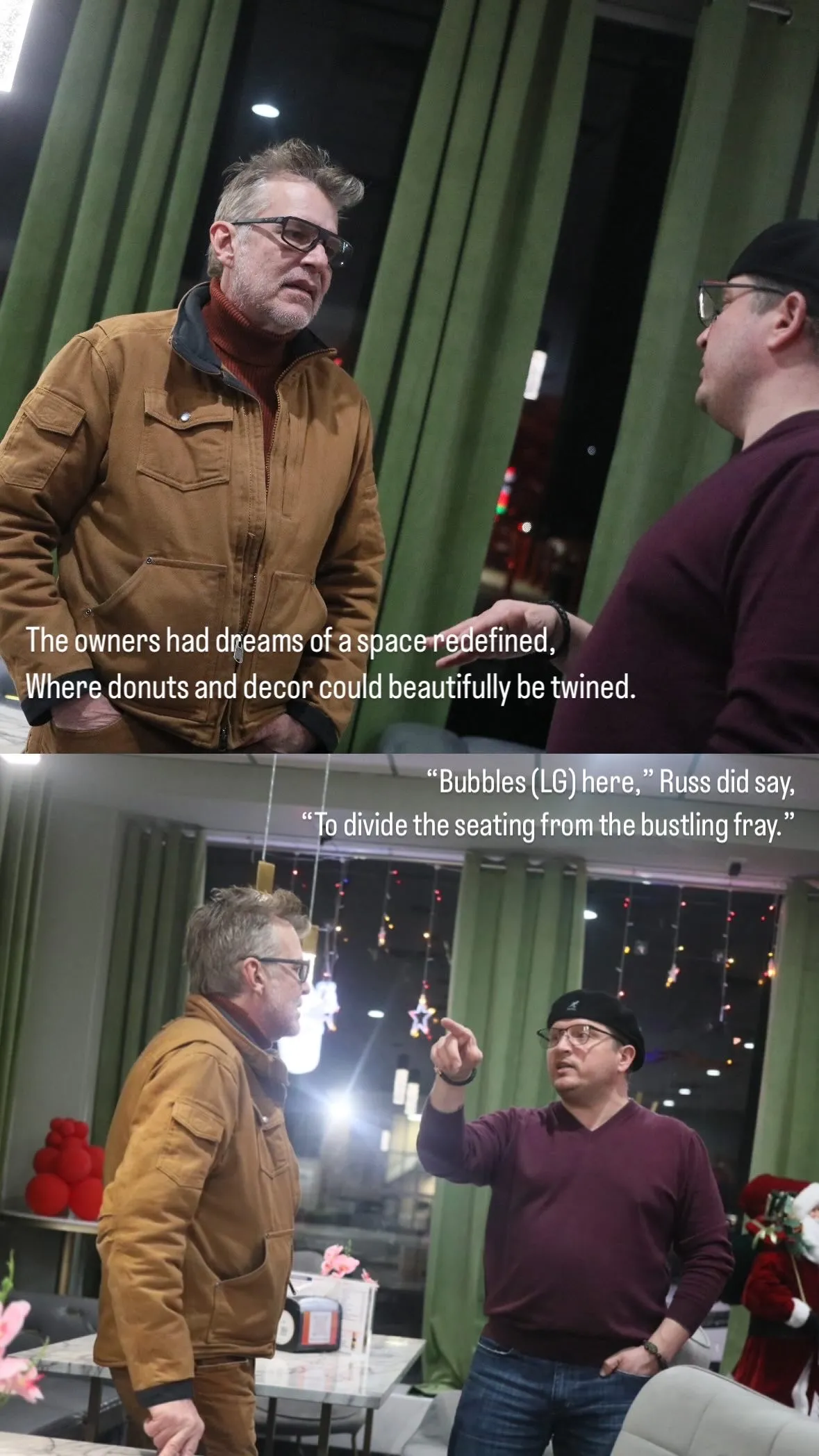 Two men engaged in conversation inside a cafe with green curtains and festive decorations.
