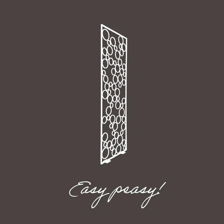 White decorative room divider panel with varying sized circles on a dark background above handwritten text saying 'Easy peasy!'